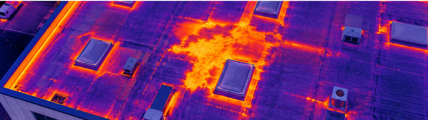 Thermal roof inspection showing a temperature anomaly across a commercial flat roof